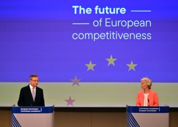 Italian former prime minister and economist Mario Draghi (L) speaks as European Commission President Ursula von der Leyen listens on during a joint press conference about the future of European competitiveness at the EU headquarters in Brussels on September 9, 2024. (Photo by Nicolas TUCAT / AFP)